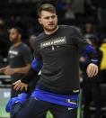 Jan 21, 2019; Milwaukee, WI, USA; Dallas Mavericks forward Luka Doncic (77) warms up before game against the Milwaukee Bucks at the Fiserv Forum. Mandatory Credit: Benny Sieu-USA TODAY Sports