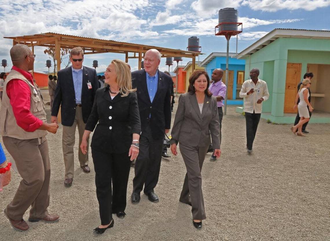 In this 2012 file photo, U.S. Secretary of State Hillary Clinton, center, tours a housing development near Caracol Industrial Park with Sen. Patrick Leahy and Labor Secretary Hilda Solis. The park opened for business on Monday, Oct. 22, 2012, in Caracol, Haiti.