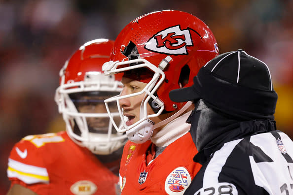 KANSAS CITY, MISSOURI – JANUARY 13: Patrick Mahomes #15 of the Kansas City Chiefs heads to the sideline after his helmet was cracked during the third quarter in the AFC Wild Card Playoffs against the Miami Dolphins at GEHA Field at Arrowhead Stadium on January 13, 2024 in Kansas City, Missouri. (Photo by David Eulitt/Getty Images)