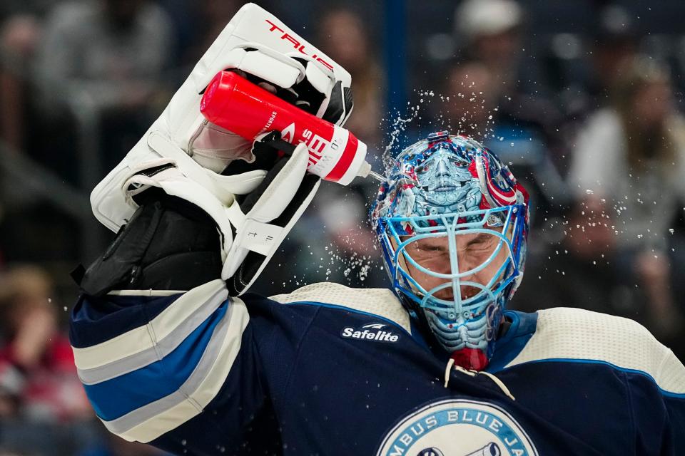 Mar 30, 2024; Columbus, Ohio, USA; Columbus Blue Jackets goaltender Elvis Merzlikins (90) sprays himself wiht water during the second period of the NHL hockey game against the Pittsburgh Penguins at Nationwide Arena.