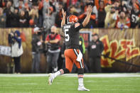 Cleveland Browns quarterback Case Keenum (5) celebrates a 4-yard touchdown run by running back D'Ernest Johnson during the first half of an NFL football game against the Denver Broncos, Thursday, Oct. 21, 2021, in Cleveland. (AP Photo/David Richard)