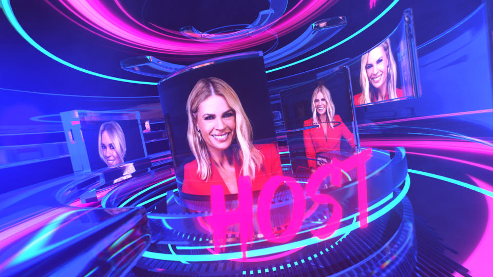 Sonia Kruger in a red jacket as the host of Big Brother