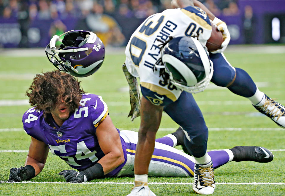 <p>Minnesota Vikings middle linebacker Eric Kendricks, left, loses his helmet as he chases Los Angeles Rams running back Todd Gurley (30) during the first half of an NFL football game, Sunday, Nov. 19, 2017, in Minneapolis. (AP Photo/Bruce Kluckhohn) </p>