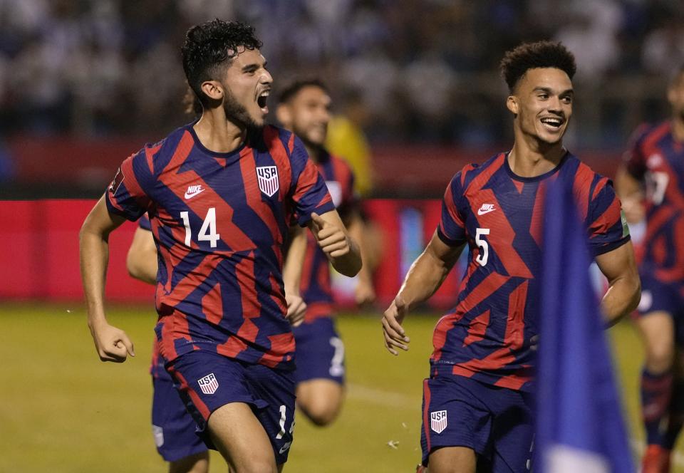 United States' Ricardo Pepi, left, celebrates scoring his side's second goal against Honduras during a qualifying soccer match for the FIFA World Cup Qatar 2022, in San Pedro Sula, Honduras, Wednesday, Sept. 8, 2021. (AP Photo/Moises Castillo)