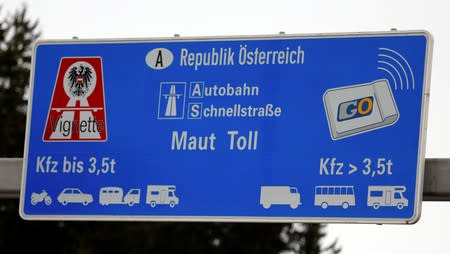 FILE PHOTO: A sign advertising the sale of Austrian motorway road toll stickers is seen on the A8 highway near the German/Austrian border