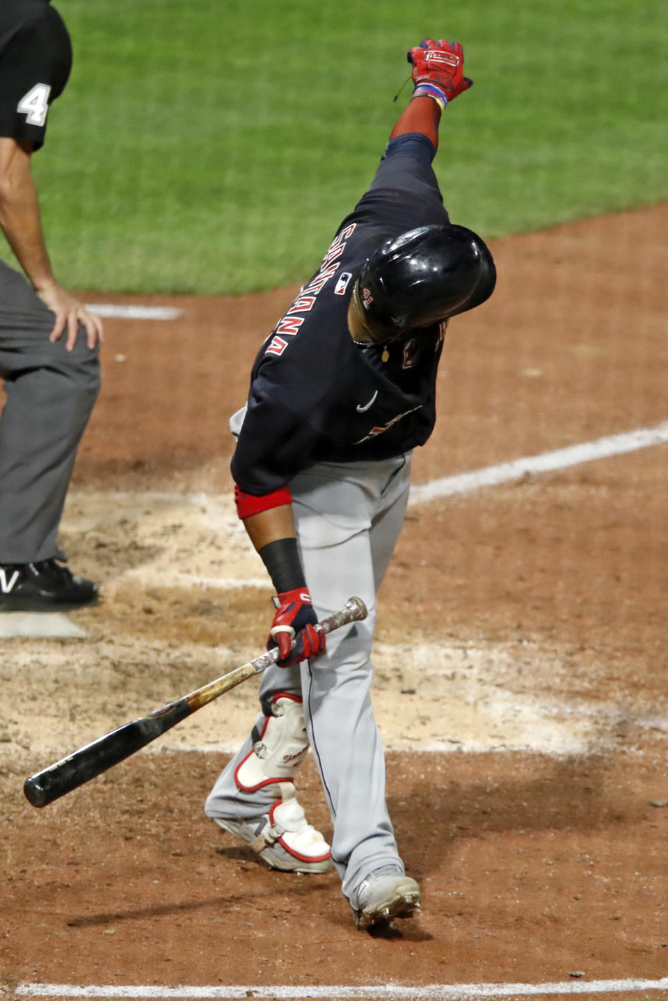 Cleveland Indians' Carlos Santana watches his three-run home run clear the left-field foul pole during the tenth inning of a baseball game against the Pittsburgh Pirates in Pittsburgh, Tuesday, Aug. 18, 2020. (AP Photo/Gene J. Puskar)