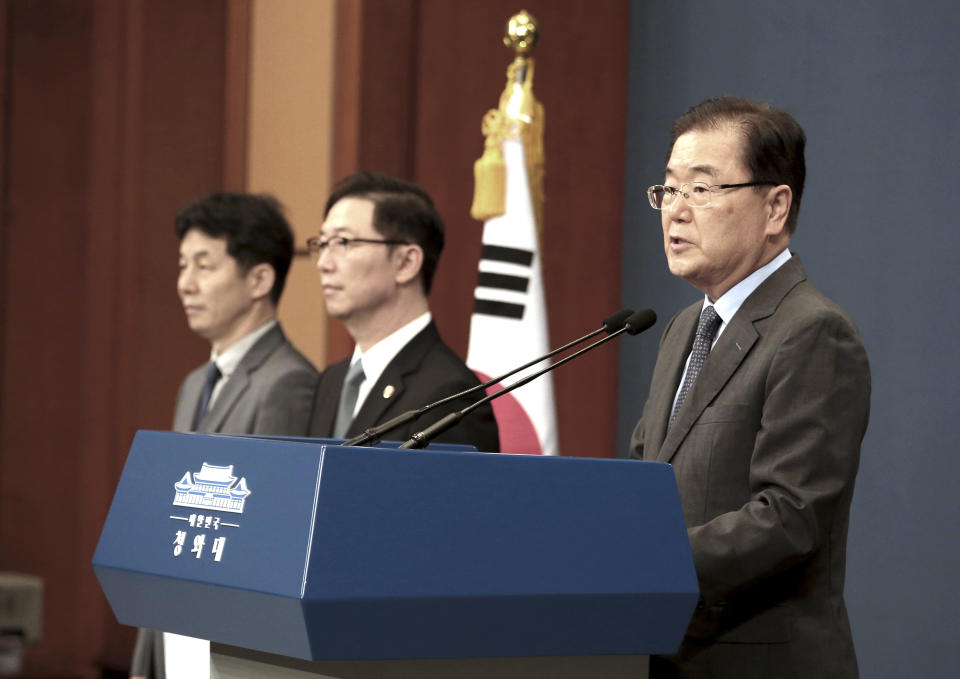 South Korean National Security Director Chung Eui-yong, right, speaks during a press conference at the presidential Blue House in Seoul, Thursday, Sept. 6, 2018. North Korean leader Kim Jong Un reaffirmed his commitment to a nuclear-free Korean Peninsula amid a growing standoff with the United States, his state-controlled media reported Thursday after a South Korean delegation met him to set up an inter-Korean summit. (AP Photo/Ahn Young-joon)