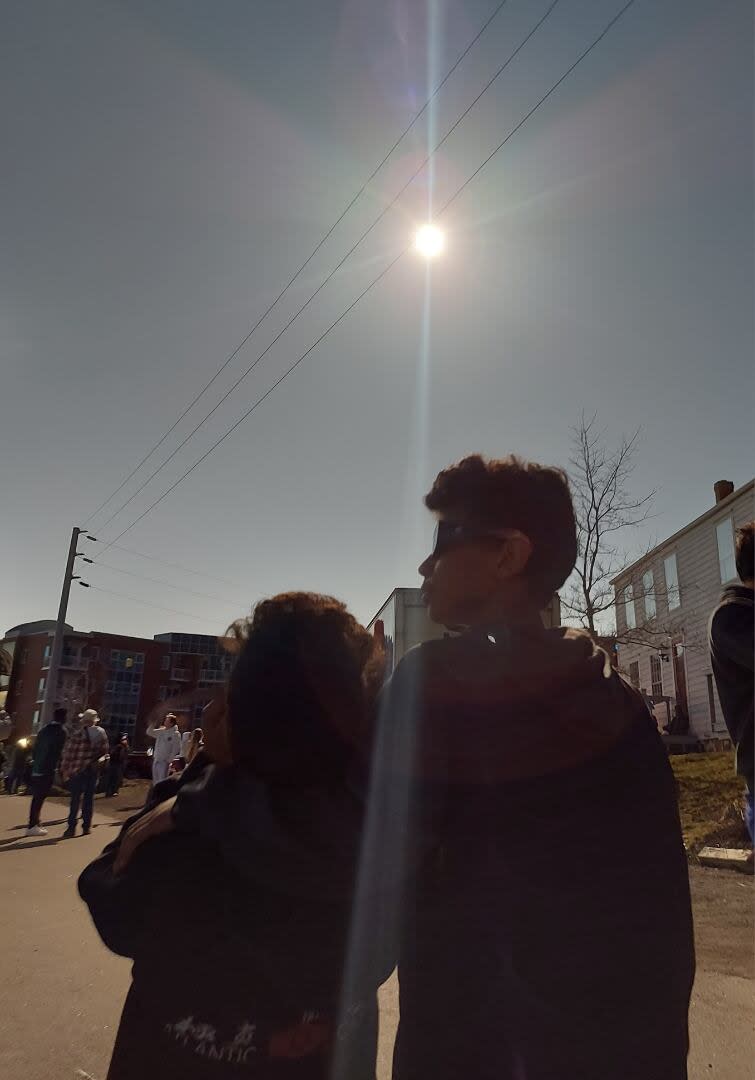 Blanco watched the solar eclipse with her family. Pictured are her sons, Nikko, 8, and EJ, 11, watching the event with their eclipse glasses.