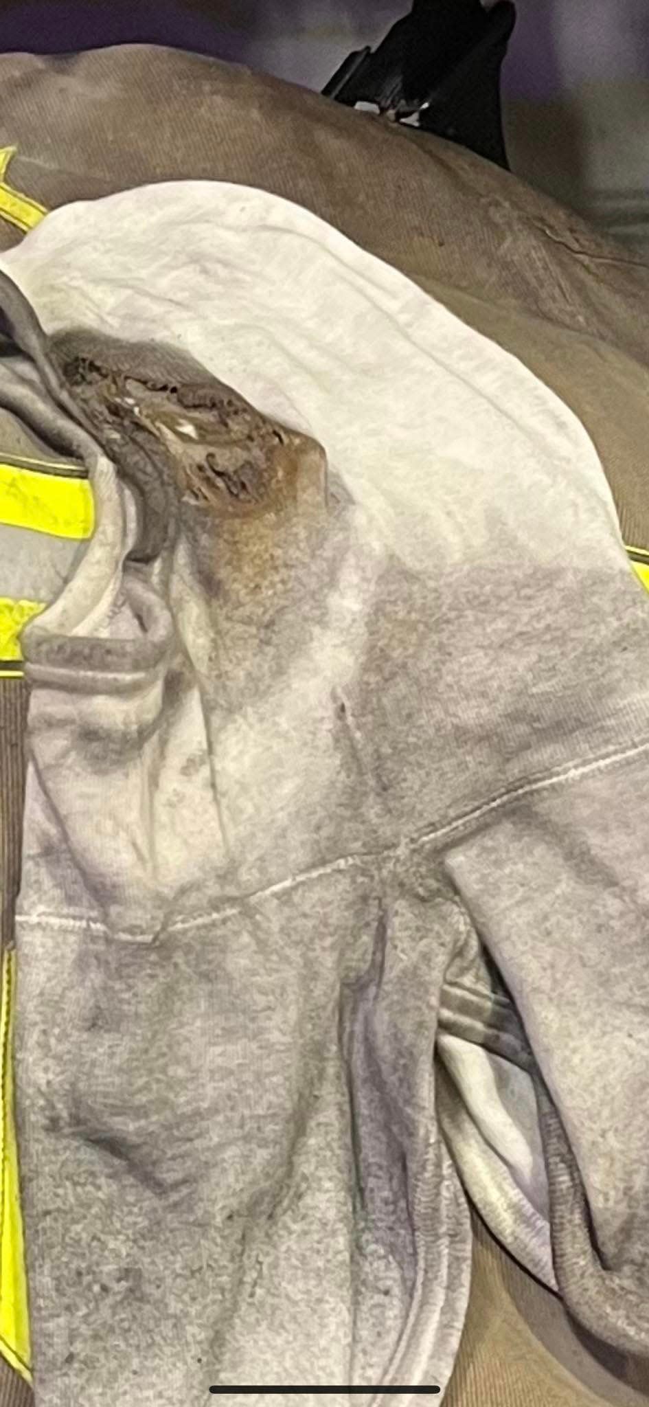 Damage to a Berkeley County Fire Department firefighter's turnout gear is shown from when he entered a Winchester Avenue house fire on April 26 in attempt to save two occupants reportedly trapped inside. One of the residents died.