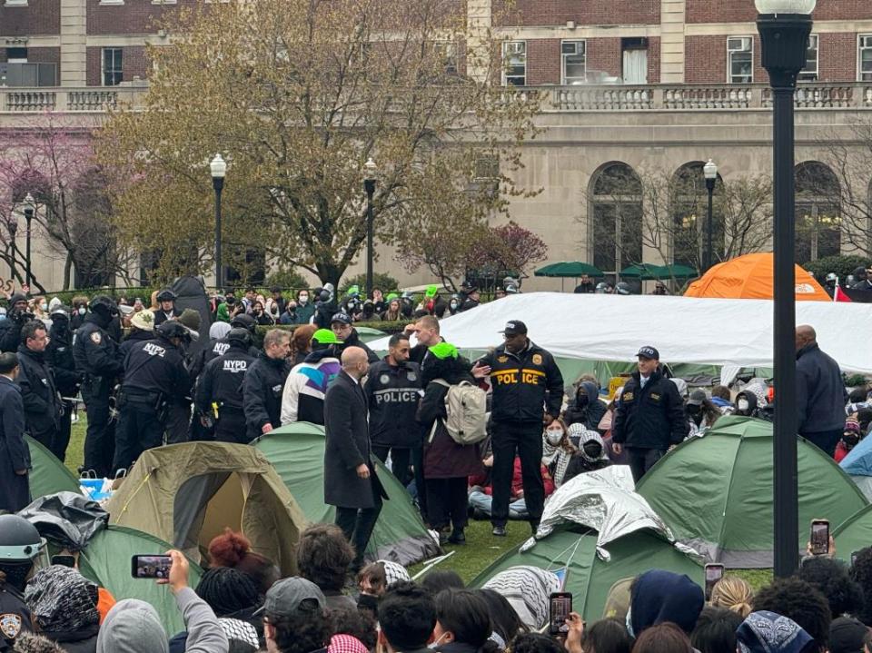 Cops confront the protesters. Robert Miller