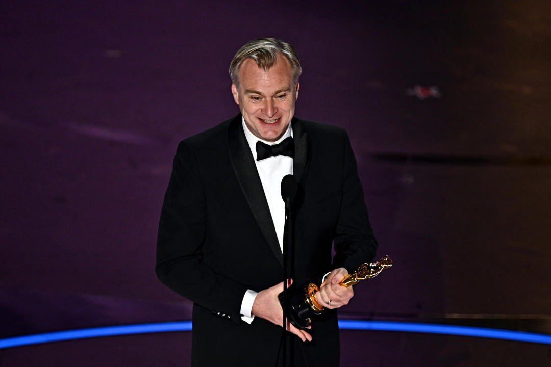 British director Christopher Nolan accepts the award for Best Director for 