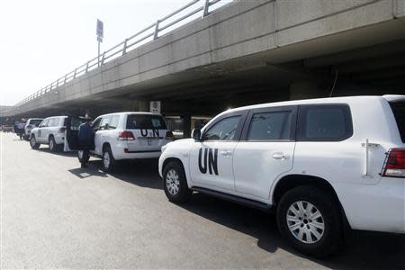 A convoy of cars of United Nations inspectors are seen arriving at Beirut airport August 31, 2013. REUTERS/Jamal Saidi
