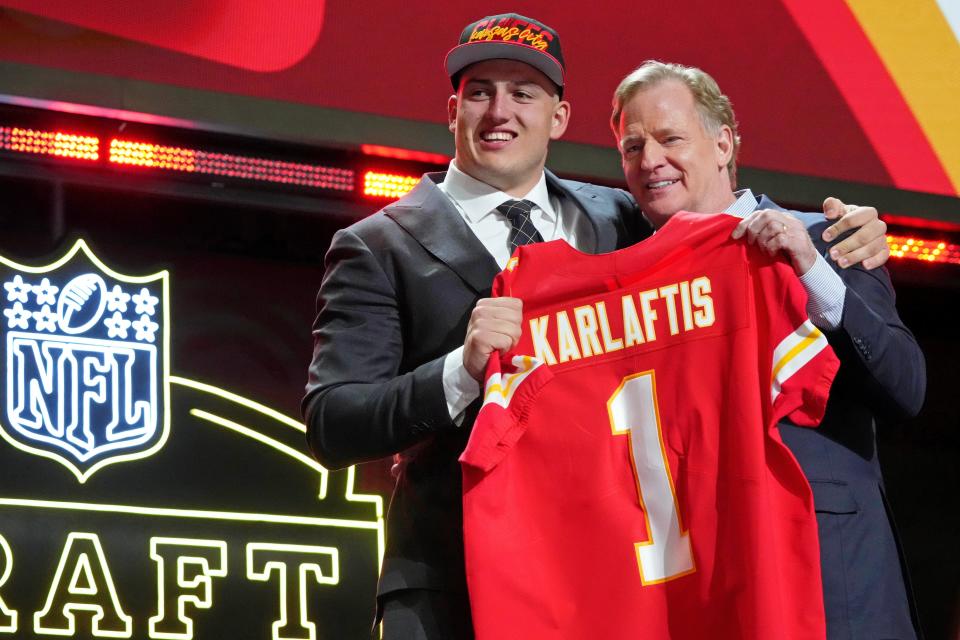 Purdue defensive end George Karlaftis poses with NFL commissioner Roger Goodell after being selected by the Kansas City Chiefs.