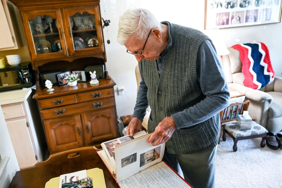 Robert Vondale, 97, looks through a scrapbook from his time serving on Monday, July 18, 2022, at his home in Grand Ledge. Vondale is one of the few surviving members of the World War II U.S. Army Ranger battalions. Last month President Biden signed an order to award rangers the Congressional Gold Medal.