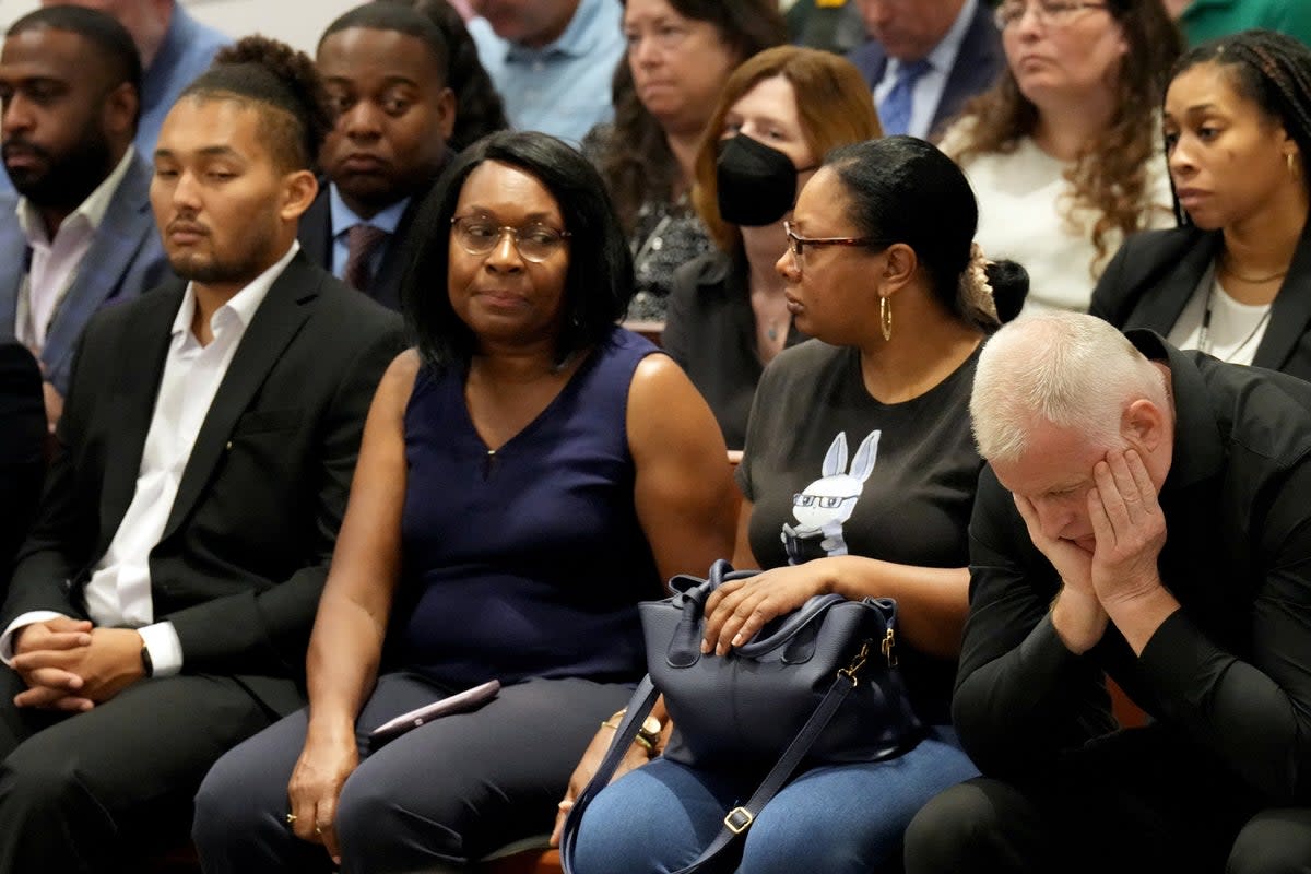 Anne Marie Ramsay and Vincent Ramsay react as they hear that Cruz will not receive the death penalty as the verdicts were announced Thursday (VIA REUTERS)