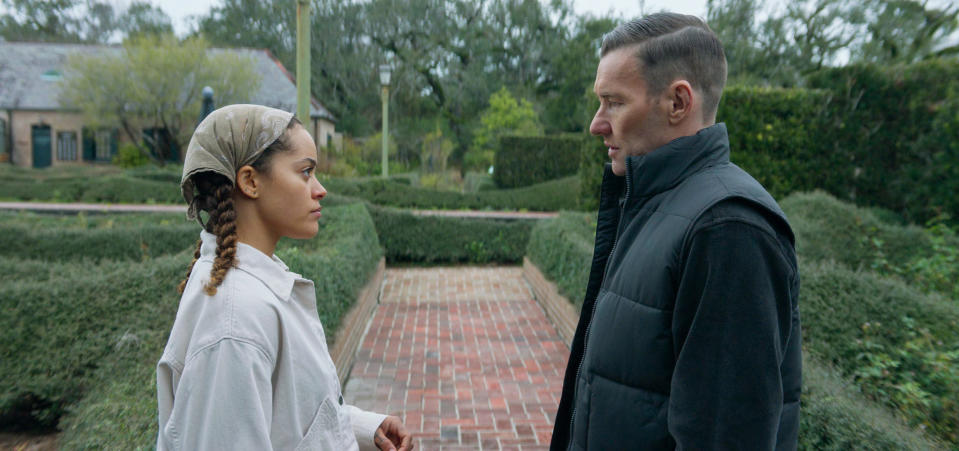 This image released by Magnolia Pictures shows Quintessa Swindell, left, and Joel Edgerton in a scene from "Master Gardener." (Magnolia Pictures via AP)