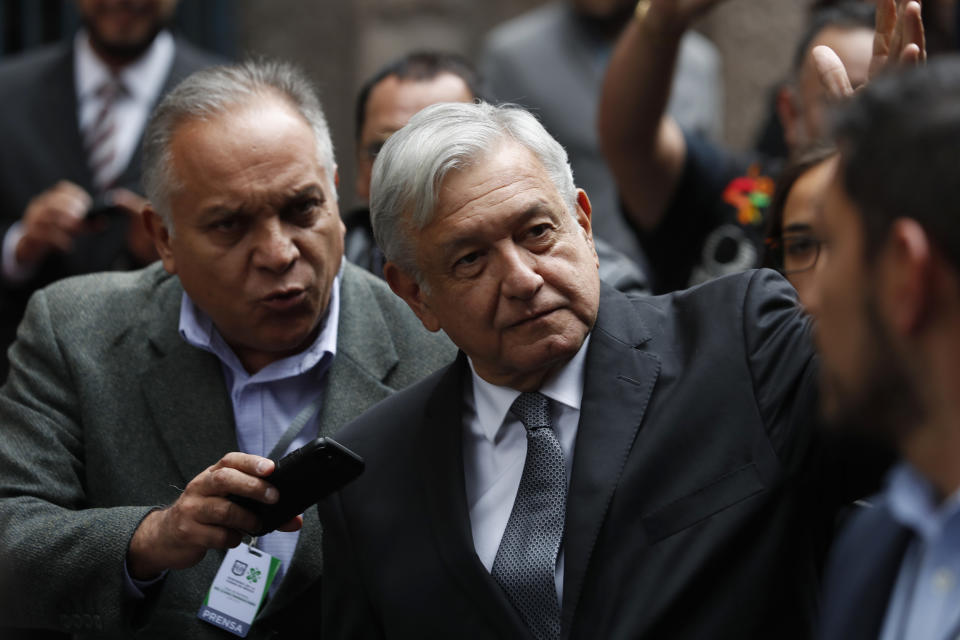 Mexico's President Andres Manuel Lopez Obrador waves as he arrives for the swearing-in ceremony for Mayor-elect Claudia Sheinbaum, in Mexico City, Wednesday, Dec. 5, 2018. Sheinbaum is the first woman to be elected mayor of Mexico City. (AP Photo/Moises Castillo)