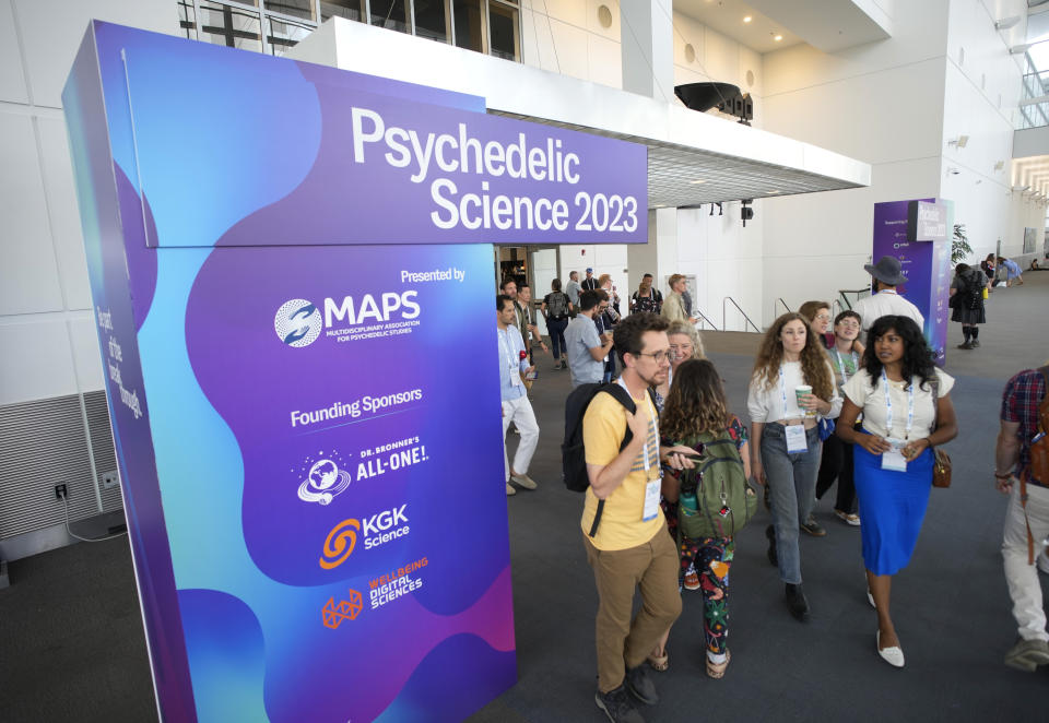 Participants leave the exhibit hall at the Psychedelic Science conference in the Colorado Convention Center Wednesday, June 21, 2023, in Denver. (AP Photo/David Zalubowski)