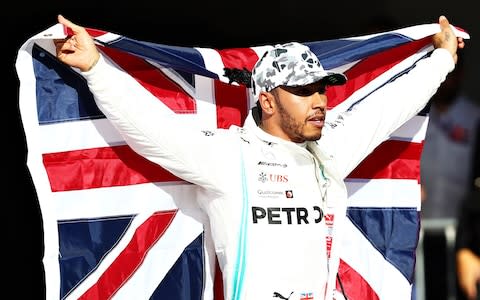 Lewis Hamilton celebrates his sixth world title - Credit: Getty Images