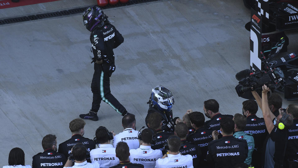 Mercedes driver Lewis Hamilton of Britain walks away after placing third in the Russian Formula One Grand Prix, at the Sochi Autodrom circuit, in Sochi, Russia, Sunday, Sept. 27, 2020. (Kirill Kudryavtsev, Pool via AP)