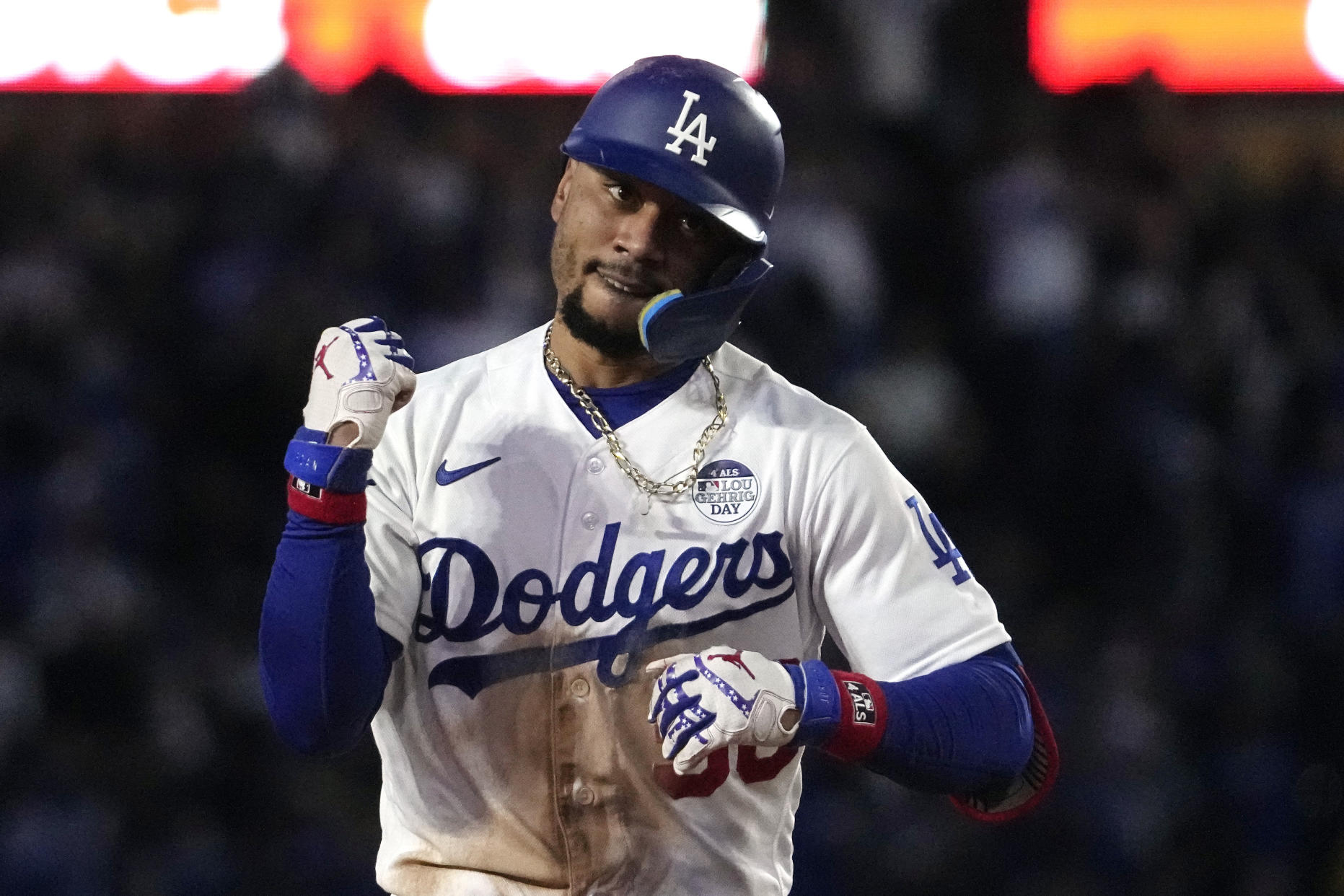 The Dodgers' Mookie Betts celebrates after hitting a solo home run during the sixth inning, his second homer Friday against the Yankees. (AP Photo/Mark J. Terrill)