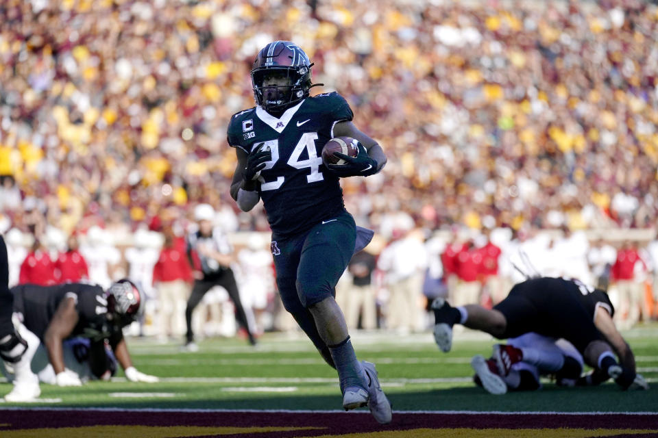 Minnesota running back Mohamed Ibrahim (24) runs for a touchdown during the first half of an NCAA college football game against Rutgers, Saturday, Oct. 29, 2022, in Minneapolis. (AP Photo/Abbie Parr)