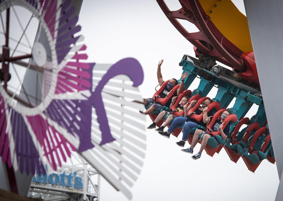 People riding a rollercoaster at Knott's Berry Farm