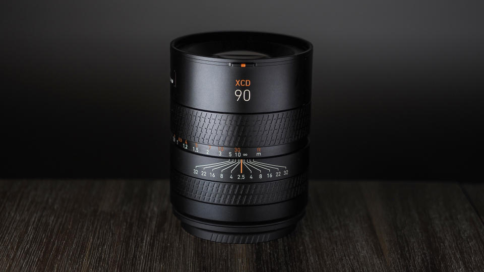 Hasselblad XCD 90V on a wooden surface against a dark background