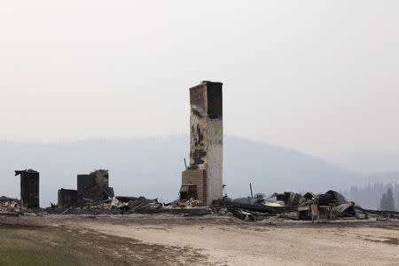 The remnants of a home consumed by the Carlton Complex Fire are pictured near Malott, Washington July 20, 2014. REUTERS/David Ryder