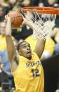 Wichita State's Darius Carter dunks against Southern Illinois in the first half of an NCAA college basketball game Tuesday, Feb. 11, 2014, in Wichita, Kan. Wichita State won 78-67. (AP Photo/The Wichita Eagle, Fernando Salazar) LOCAL TV OUT; MAGS OUT; LOCAL RADIO OUT; LOCAL INTERNET OUT