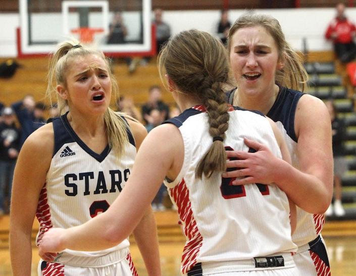 BNL&#39;s Chloe Spreen (left), Carlee Kern (middle) and Ella Turner (right) celebrate a fast-break basket by Kern during Wednesday night&#39;s 59-40 victory over Noblesville in the title game of the Limestone Classic Tourney.