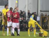 <p>Manchester United’s Henrikh Mkhitaryan is booked for a challenge Fedor Kudryashov</p>