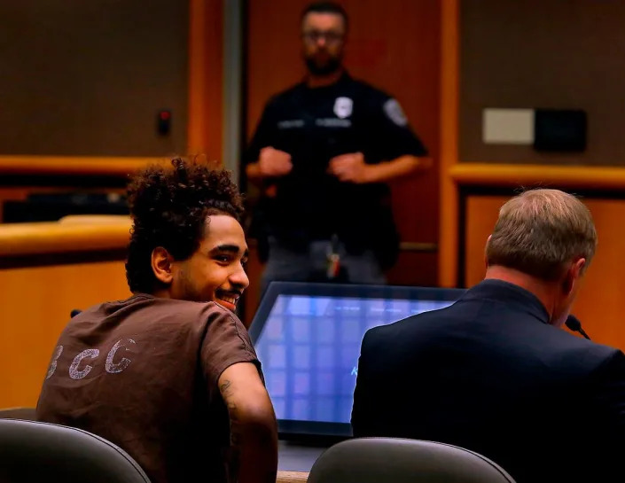 Murder suspect Isaiah Combs, 20, grins while looking around a Benton County Superior courtroom Friday during his preliminary hearing for his alleged involvement in the Oct. 15, 2022 shooting death of Jatzivy Sarabia in the area of Highway 397 and East 3rd Avenue. Combs is seated next to his defense attorney Eric Scott.