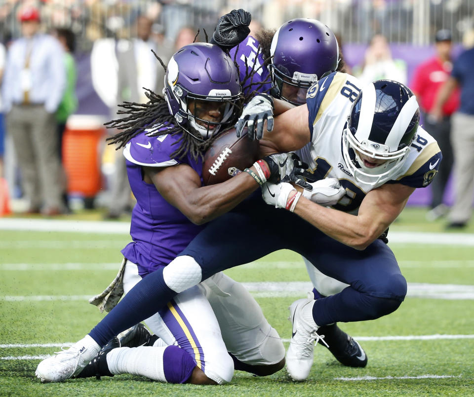 Minnesota Vikings strong safety Anthony Harris, left, strips the ball from Los Angeles Rams wide receiver Cooper Kupp. (AP)