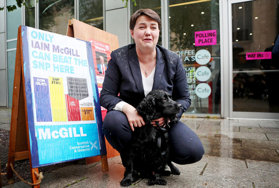 <p>Scottish Conservative leader Ruth Davidson with her dog, called Wilson, as she arrives to cast her vote in the General Election at a polling station at Cafe Comino in Edinburgh. (Photo: Jane Barlow//Getty Images) </p>