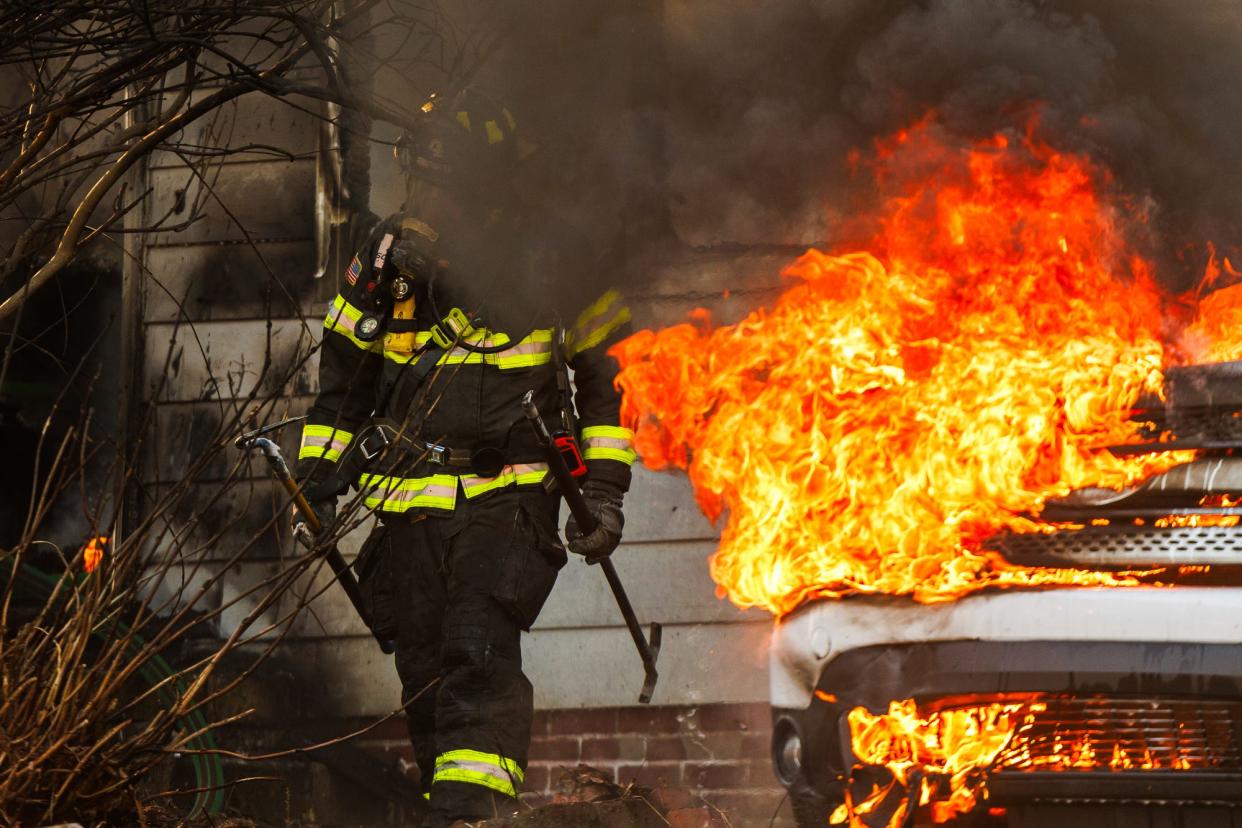 Firefighters work at the scene of a double-fatal house fire caused by a resident smoking on home oxygen in West Manheim Township, Pennsylvania. Five people were in the home when the fire broke out, with a four-year-old and a 79-year old dying, one occupant transported, and two others declining EMS.