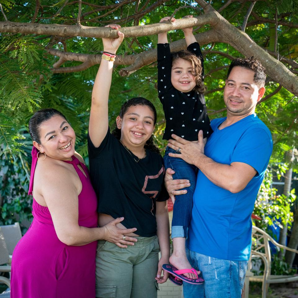 Karina Castaneda Medina (left) with her family, Alondra Galeano, Amy Galeano and Javier Galeano outside their home in Lake Worth Beach.