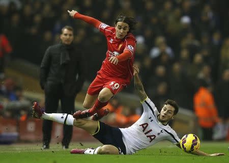 Tottenham Hotspur's Ryan Mason (R) challenges Liverpool's Lazar Markovic during their English Premier League soccer match at Anfield in Liverpool, northern England, February 10, 2015. REUTERS/Phil Noble/Files