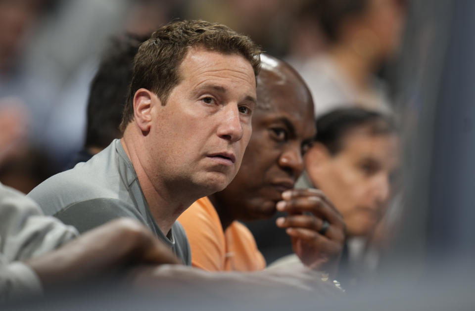 Phoenix Suns owner Mat Ishbia, front, and Michigan State head football coach Mel Tucker look on in the first half of Game 5 of an NBA basketball semifinal playoff series against the Denver Nuggets Tuesday, May 9, 2023, in Denver. (AP Photo/David Zalubowski)