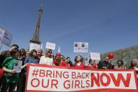 Former French first lady Valerie Trierweiler (3rdL) attends a gathering "Bring Back Our Girls" near the Eiffel Tower in Paris April 14, 2015 to mark one year since more than 200 schoolgirls were kidnapped in Chibok, north-eastern Nigeria, by Nigerian Islamist rebel group Boko Haram. (REUTERS/Gonzalo Fuentes)