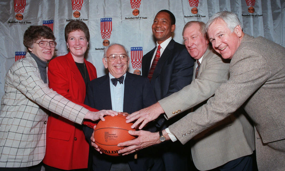 FILE - Inductees to the Basketball Hall of Fame pose at a news conference in New York, Feb. 4, 1997. From left are Joan Crawford of Nashville, Tenn.; Denise Curry of UCLA; Pete Carril of Princeton; Alex English of the Denver Nuggets; Don Haskins of UTEP; and Bailey Howell of the Detroit Pistons. Carril, the rumpled, cigar-smoking basketball coach who led Princeton to 11 appearances in the NCAA tournament, where his teams unnerved formidable opponents and rattled March Madness with old-school fundamentals, died Monday, Aug. 15, 2022. He was 92. (AP Photo/Marty Lederhandler, File)