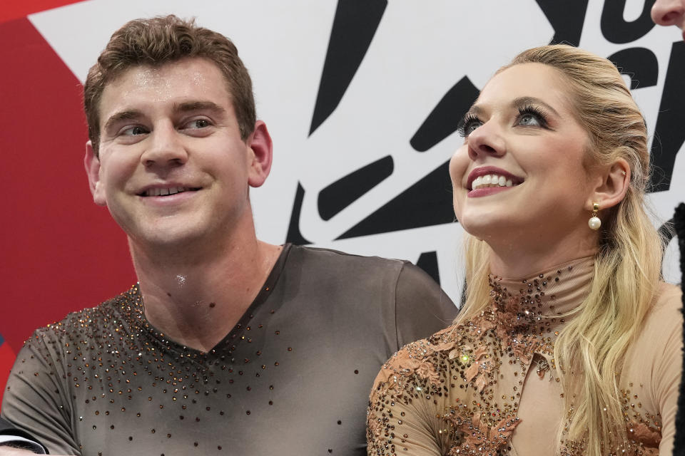 Brandon Frazier, left, and Alexa Knierim smile after performing during the pairs free skate at the U.S. figure skating championships in San Jose, Calif., Saturday, Jan. 28, 2023. Frazier and Knierim finished first in the event. (AP Photo/Tony Avelar)