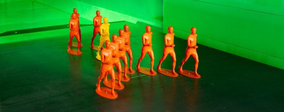 Orange figurines showing a V-shape formation.
