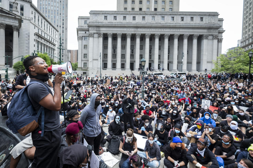 MANHATTAN, NY - JUNE 02: A massive group of protesters sit on the ground at Foley Square in a show of peaceful protest while they listen to a speaker.  Protesters took to the streets across America after the killing of George Floyd at the hands of a white police officer Derek Chauvin that was kneeling on his neck during his arrest as he pleaded that he couldn't breathe. The protest are attempting to give a voice to the need for human rights for African American's and to stop police brutality against people of color.  Many people were wearing masks and observing social distancing due to the coronavirus pandemic.  Leaders of the protest were clear that they wanted it to be a peaceful protest in light of nights of unrest looting and destruction.  Photographed in Foley Square in the  Manhattan Borough of New York on June 02, 2020, USA.  (Photo by Ira L. Black/Corbis via Getty Images)