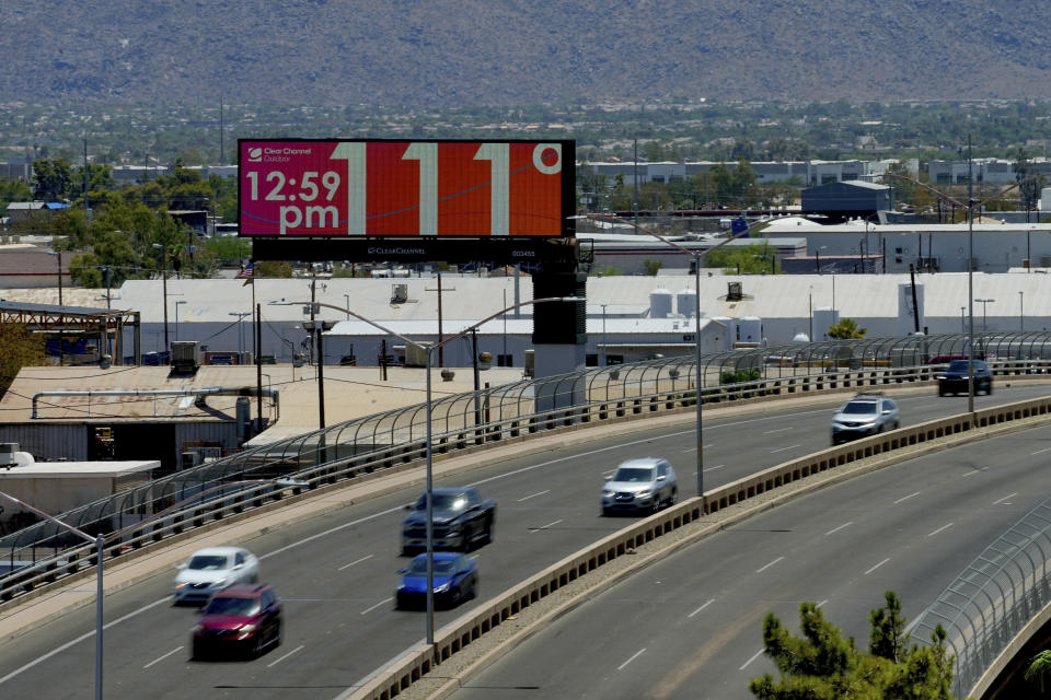 FILE - A digital billboard displays an unofficial temperature, on July 17, 2023, in downtown Phoenix. The death certificates of more than 2,300 people who died in the United States last summer mention the effects of excessive heat, the highest number in 45 years of records, according to an Associated Press analysis of Centers for Disease Control and Prevention data. With May already breaking heat records, 2024 could be even deadlier. (AP Photo/Matt York, File)