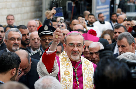 The acting Latin Patriarch of Jerusalem Pierbattista Pizzaballa participates in Christmas celebrations at Manger Square outside the Church of the Nativity in Bethlehem, in the Israeli-occupied West Bank December 24, 2018. REUTERS/Mussa Qawasma