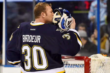 FILE PHOTO: Dec 8, 2014; St. Louis, MO, USA; St. Louis Blues goalie Martin Brodeur (30) kisses the back of his helmet before the game between the St. Louis Blues and the Florida Panthers at Scottrade Center. Mandatory Credit: Jasen Vinlove-USA TODAY Sports/File Photo