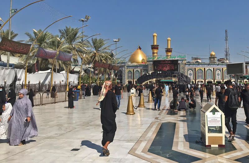 Pilgrims walk between the shrines of the Imam Abbas, and Imam Hussein in Kerbala