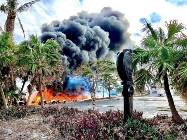 Black smoke billows from the location at The Dunes Golf and Tennis Club where the fleet of golf carts are located. The carts were engulfed in flames on Friday, Nov. 18, 2022.