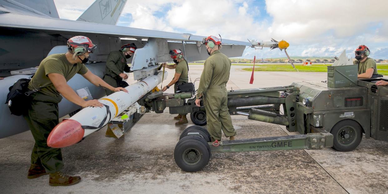 Marines load AGM-88 High Speed Anti-Radiation Missile on F/A-18C